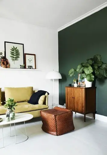 living room with green accent wall