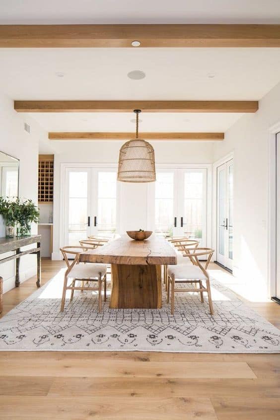 large farmhouse dining room with exposed beams
