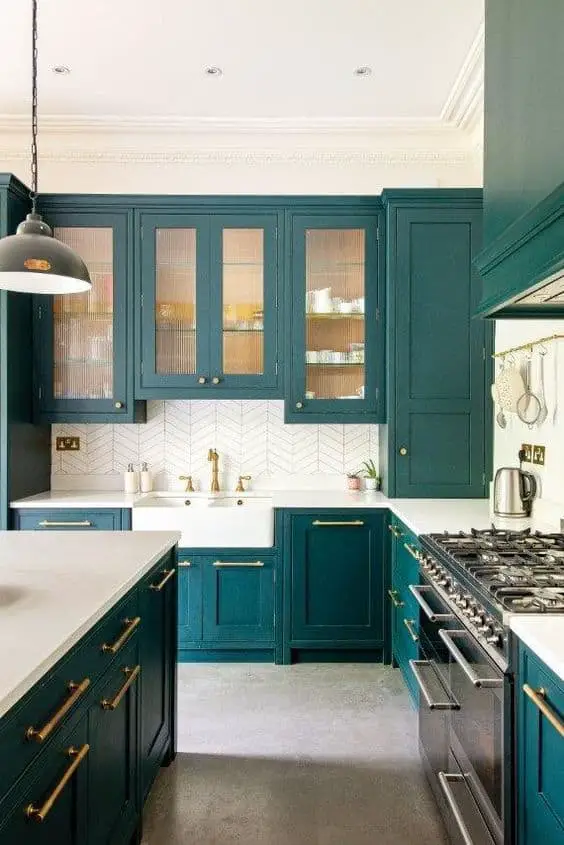 teal and white kitchen idea with gold accents
