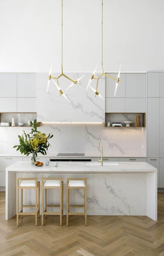 white kitchen design with golden lighting
