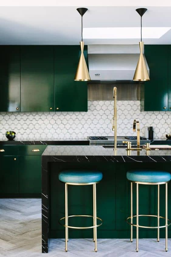 dark green kitchen island with metal accents