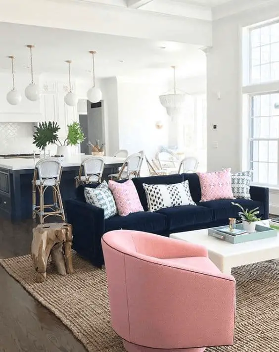 decorating with pastel colors around a navy blue sofa