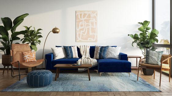 eclctric bohemian living room with a blue sofa