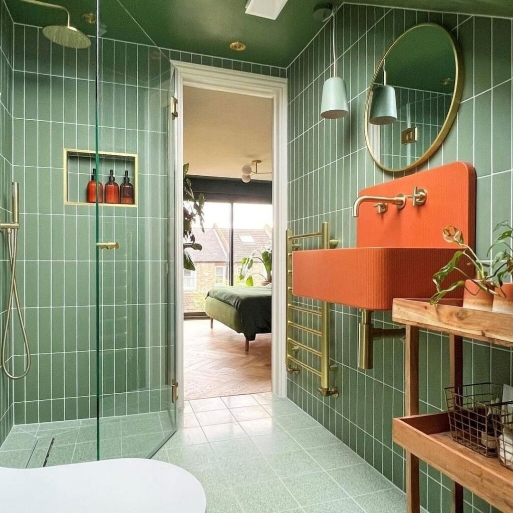 green bathroom with orange fixtures