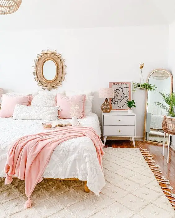 pink and cream bedroom design with rug