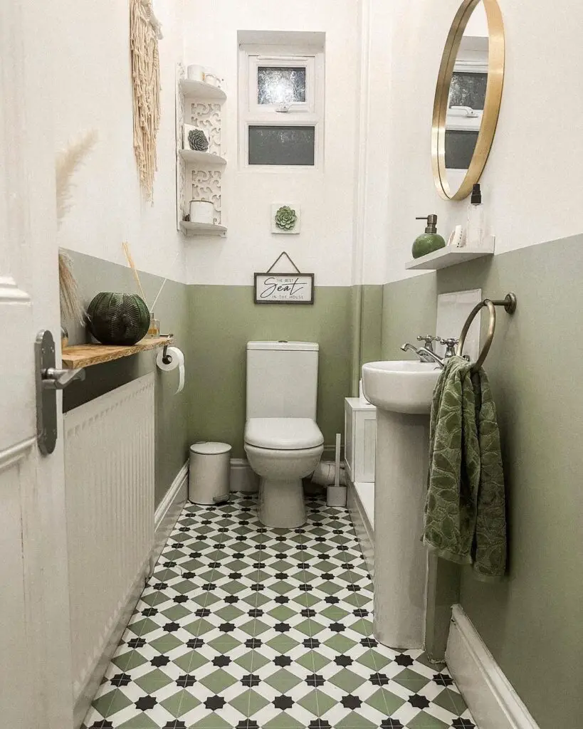 sage green and white bathroom with floor tiling
