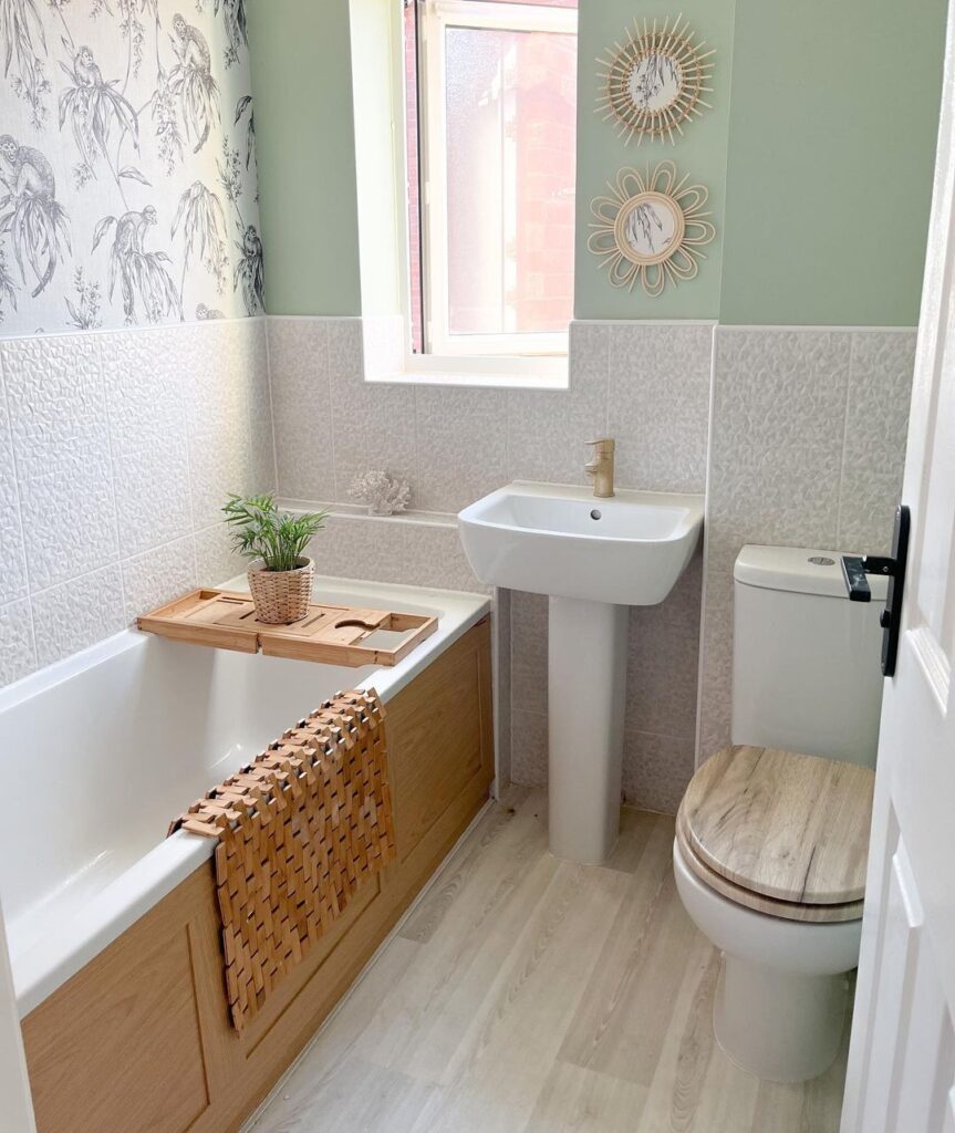 sage green color blocked wall in a bathroom